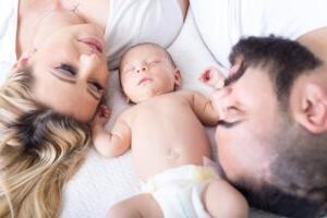 A young couple with their baby - christians in public school